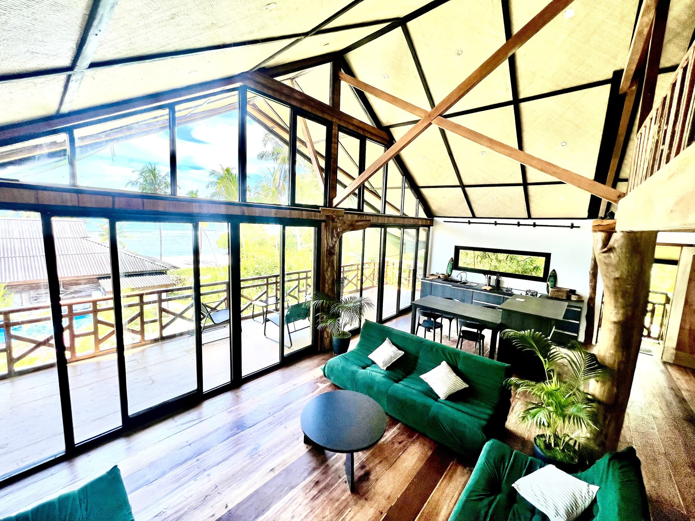 The loft’s living space, glass on three sides, looking out over the reef