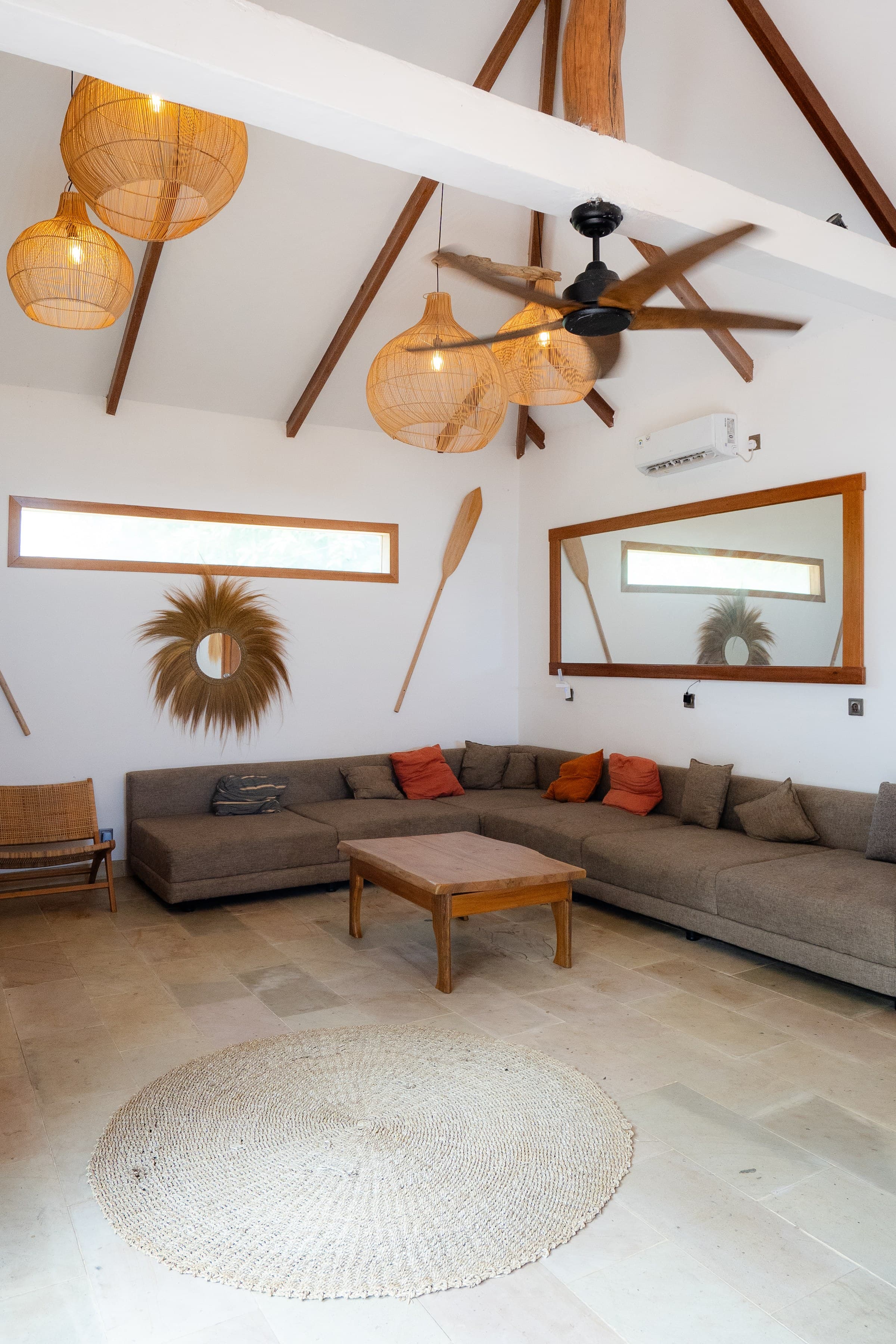 The villa’s living room, open to the roof beams